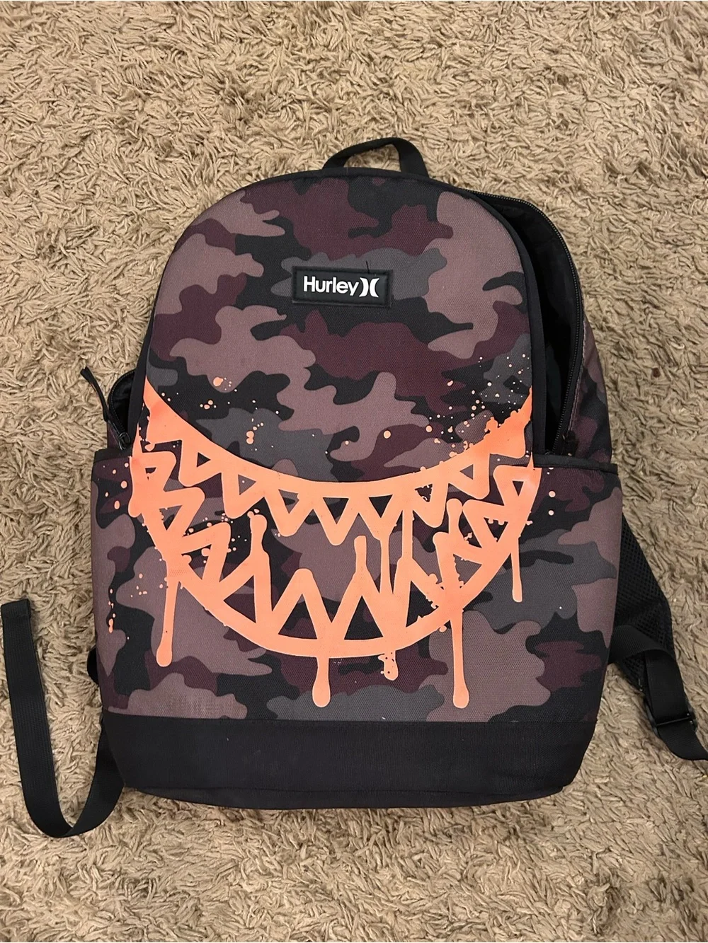 Hurley Camouflage Backpack with Orange Splash Graphic